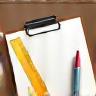 Illustration representing a sketchpad and ruler, symbolizing the design and development step.